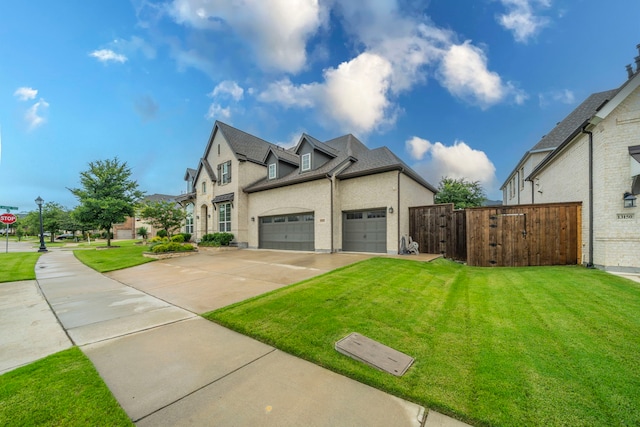 13122 Dolomite Dr, Frisco, TX 75035 - view of home's exterior with driveway, an attached garage, stucco siding, and a gate