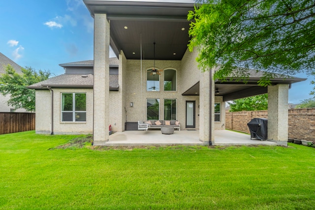 13122 Dolomite Dr, Frisco, TX 75035 - rear view of house featuring a patio area, outdoor lounge area, a fenced backyard, a shingled roof, and brick siding