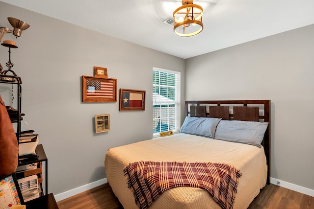 104 Nob Hill Cir, Malakoff, TX 75148 - bedroom with baseboards and wood finished floors