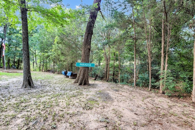 104 Nob Hill Cir, Malakoff, TX 75148 - view of yard with a wooded view
