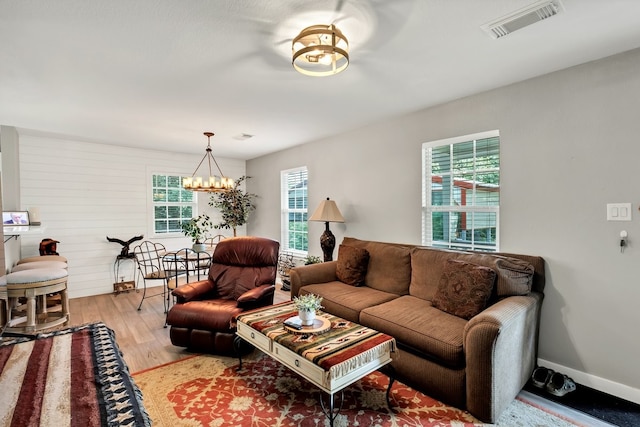 104 Nob Hill Cir, Malakoff, TX 75148 - living room with a chandelier and light wood-type flooring