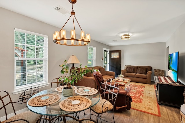 104 Nob Hill Cir, Malakoff, TX 75148 - dining room with wood finished floors, healthy amount of natural light, and a chandelier