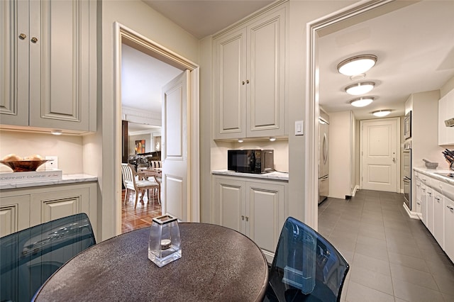 3525 Turtle Creek Blvd Unit 4E, Dallas, TX 75219 - dining area with dark tile patterned flooring