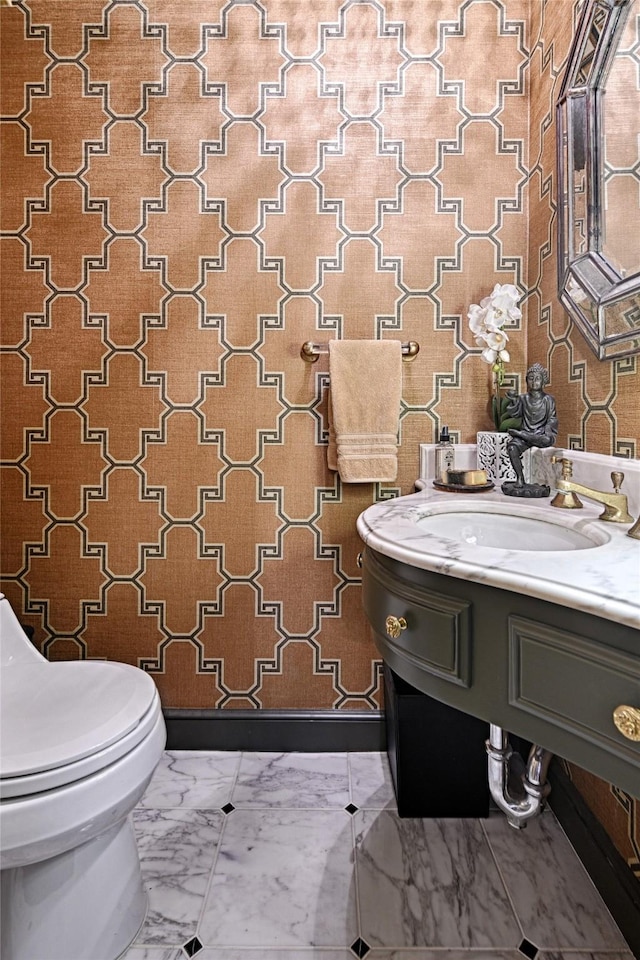 3525 Turtle Creek Blvd Unit 4E, Dallas, TX 75219 - bathroom featuring wallpapered walls, marble finish floors, and vanity