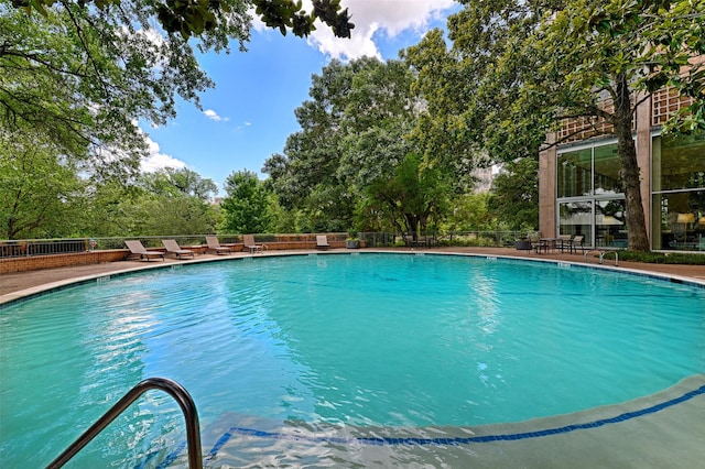 3525 Turtle Creek Blvd Unit 4E, Dallas, TX 75219 - community pool with view of scattered trees