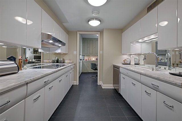 3525 Turtle Creek Blvd Unit 4E, Dallas, TX 75219 - kitchen with extractor fan, black electric stovetop, dark tile patterned flooring, and white cabinetry