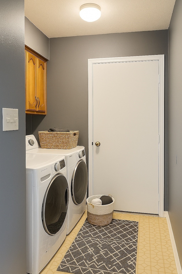 202 Modene Ave, Waxahachie, TX 75165 - laundry room featuring washer and clothes dryer and cabinet space