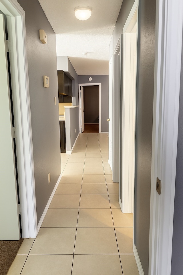 202 Modene Ave, Waxahachie, TX 75165 - hallway featuring light tile patterned floors and baseboards