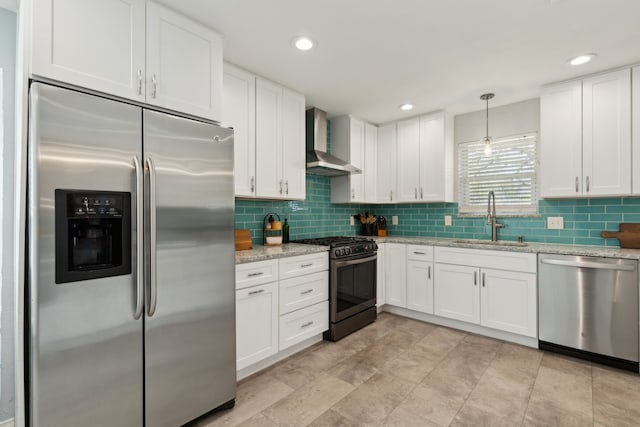 10216 Shadow Way, Dallas, TX 75243 - kitchen featuring appliances with stainless steel finishes, wall chimney range hood, tasteful backsplash, white cabinets, and recessed lighting