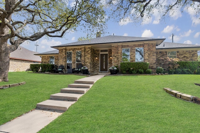 10216 Shadow Way, Dallas, TX 75243 - view of front facade with a front yard and brick siding