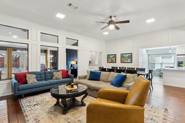 10216 Shadow Way, Dallas, TX 75243 - living area featuring a decorative wall, ceiling fan, and hardwood / wood-style flooring