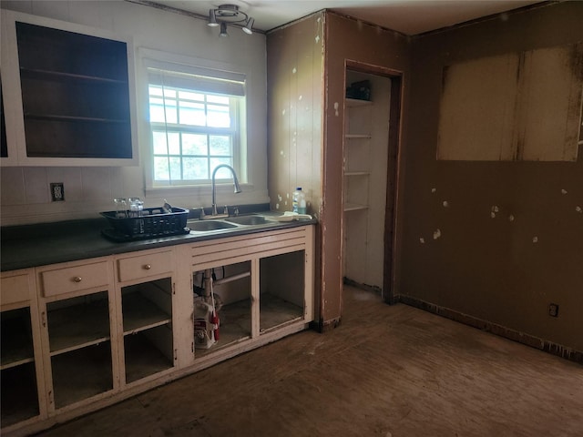1000 Harrison St, Commerce, TX 75428 - kitchen featuring a sink and dark countertops