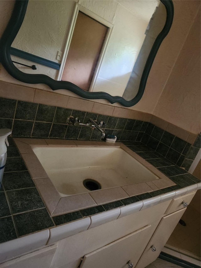 1000 Harrison St, Commerce, TX 75428 - bathroom featuring vanity and toilet