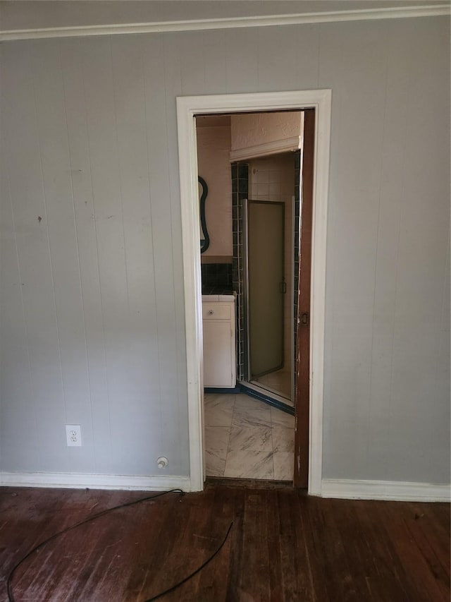 1000 Harrison St, Commerce, TX 75428 - unfurnished room with wood finished floors and baseboards