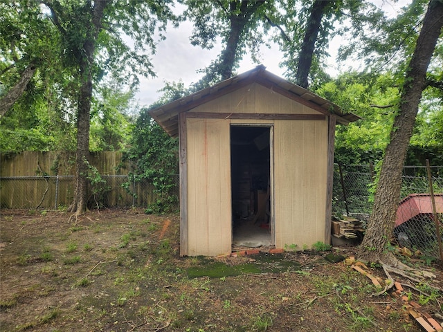 1000 Harrison St, Commerce, TX 75428 - view of shed with a fenced backyard