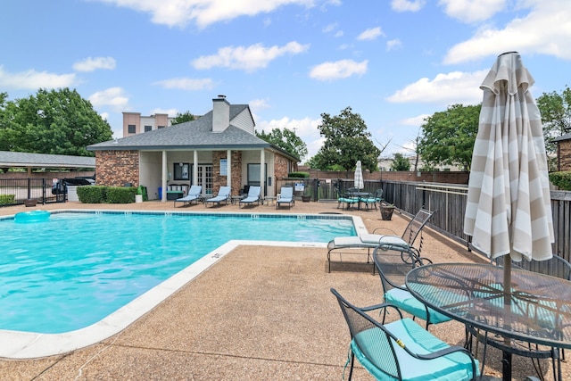825 W Harwood Rd Unit A, Hurst, TX 76054 - community pool featuring a patio and outdoor dining area