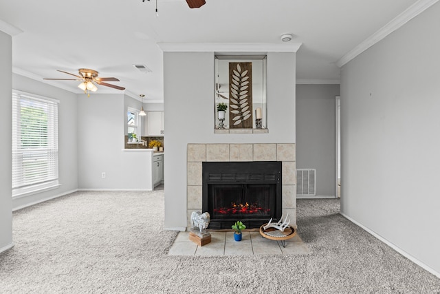 825 W Harwood Rd Unit A, Hurst, TX 76054 - carpeted living room with a ceiling fan, ornamental molding, and a tiled fireplace