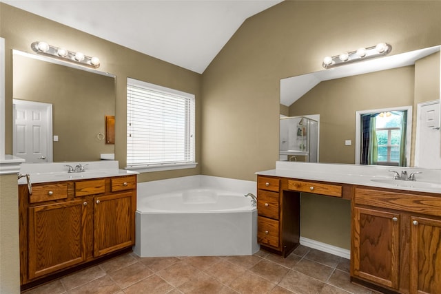 6505 Taprock Dr, Mckinney, TX 75070 - bathroom featuring lofted ceiling, a shower stall, two vanities, a bath, and tile patterned flooring