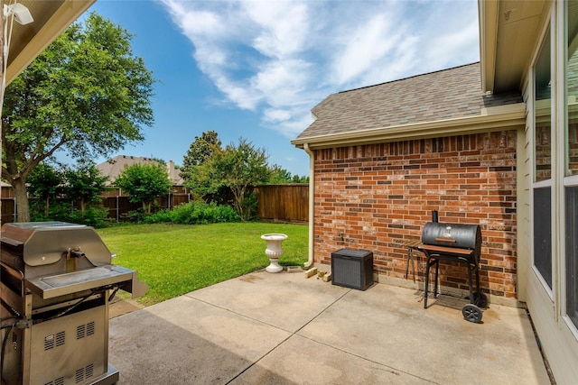 6505 Taprock Dr, Mckinney, TX 75070 - fenced backyard with a grill and a patio area
