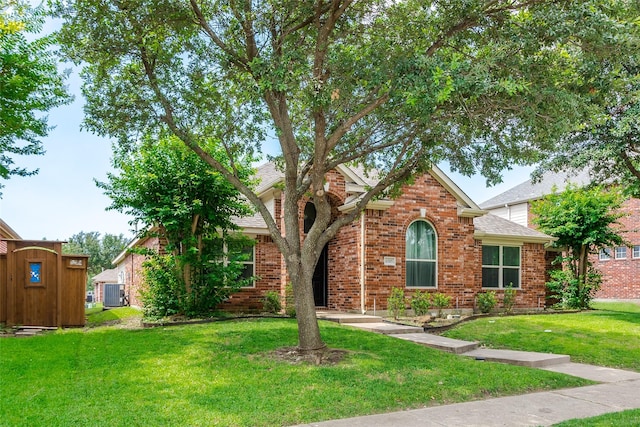 6505 Taprock Dr, Mckinney, TX 75070 - view of front facade featuring a front yard, brick siding, and a shingled roof