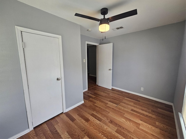511 W Lake St, Krum, TX 76249 - unfurnished bedroom featuring wood finished floors and a ceiling fan
