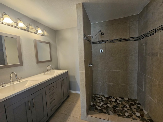 511 W Lake St, Krum, TX 76249 - full bathroom with double vanity, a tile shower, and tile patterned flooring