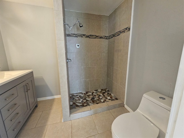 511 W Lake St, Krum, TX 76249 - bathroom featuring vanity, tiled shower, and tile patterned floors
