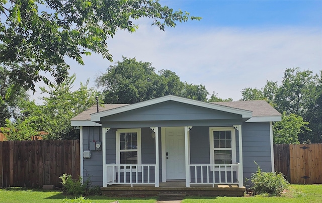 511 W Lake St, Krum, TX 76249 - view of front of property with covered porch and a shingled roof