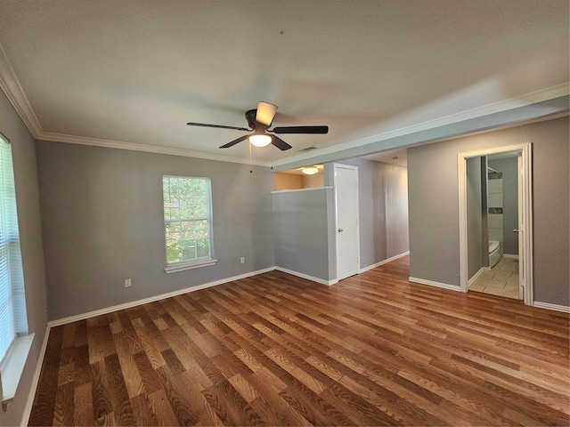 511 W Lake St, Krum, TX 76249 - spare room with ornamental molding, wood finished floors, and a ceiling fan