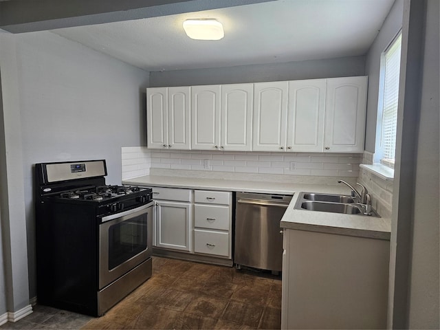 511 W Lake St, Krum, TX 76249 - kitchen with stainless steel appliances, backsplash, white cabinetry, and healthy amount of natural light