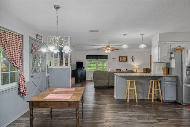 180 Vz County Road 4202, Canton, TX 75103 - dining area with dark wood finished floors, ceiling fan, and a chandelier