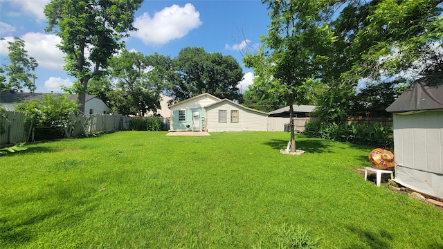 401 Lawrence Ave, Terrell, TX 75160 - fenced backyard with an outbuilding