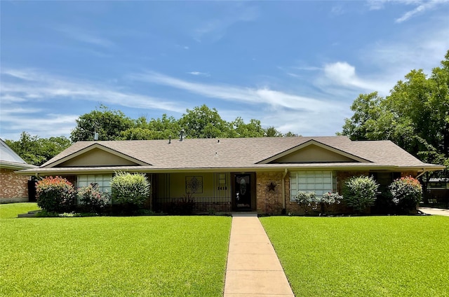 1410 Yarborough Dr, Sherman, TX 75092 - ranch-style house featuring a front lawn, roof with shingles, and brick siding
