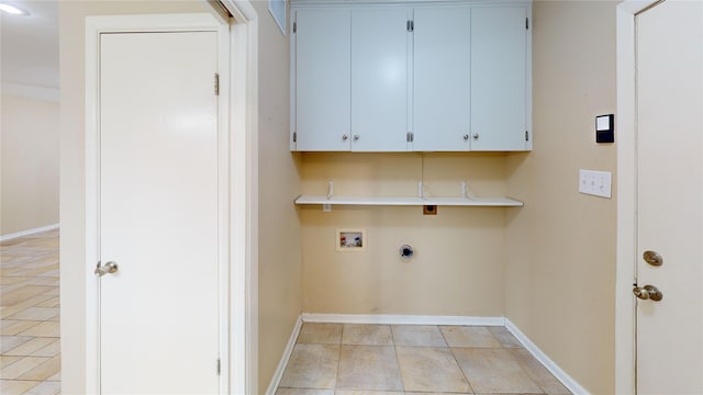 1410 Yarborough Dr, Sherman, TX 75092 - washroom featuring hookup for a washing machine, cabinet space, and light tile patterned floors