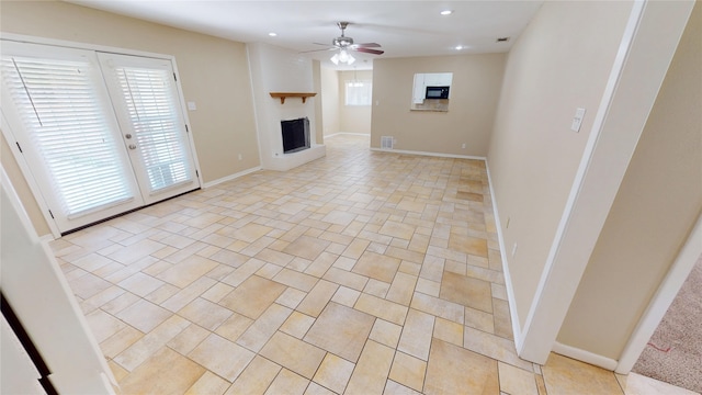 1410 Yarborough Dr, Sherman, TX 75092 - unfurnished living room with ceiling fan, recessed lighting, and a fireplace with raised hearth