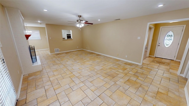 1410 Yarborough Dr, Sherman, TX 75092 - unfurnished living room featuring ceiling fan, healthy amount of natural light, recessed lighting, and light tile patterned flooring