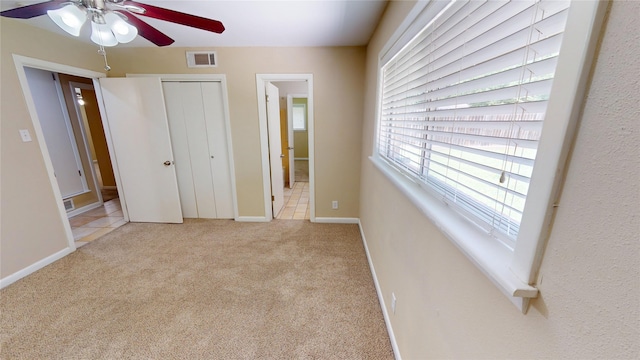 1410 Yarborough Dr, Sherman, TX 75092 - unfurnished bedroom with carpet floors, connected bathroom, a closet, and a ceiling fan