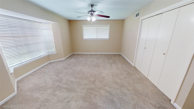 1410 Yarborough Dr, Sherman, TX 75092 - unfurnished bedroom with light colored carpet, a closet, and ceiling fan