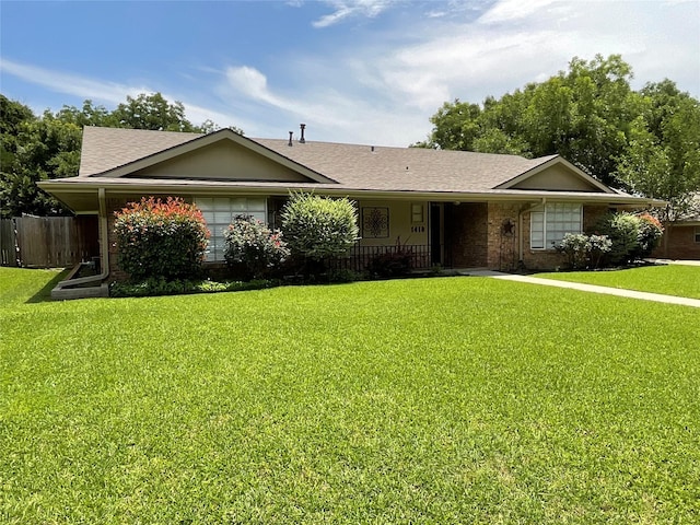 1410 Yarborough Dr, Sherman, TX 75092 - ranch-style home with brick siding and roof with shingles