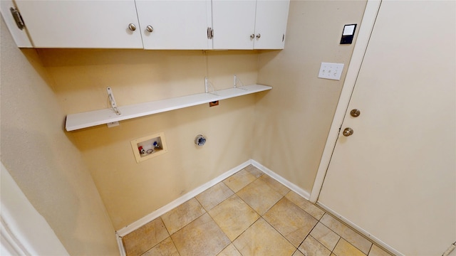 1410 Yarborough Dr, Sherman, TX 75092 - washroom with cabinet space, washer hookup, and light tile patterned flooring
