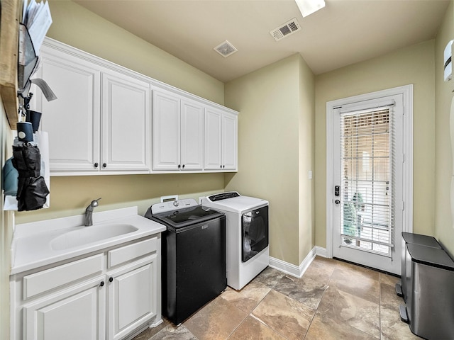 3309 Laurel Fork Dr, Mckinney, TX 75070 - laundry area with cabinet space and washing machine and clothes dryer