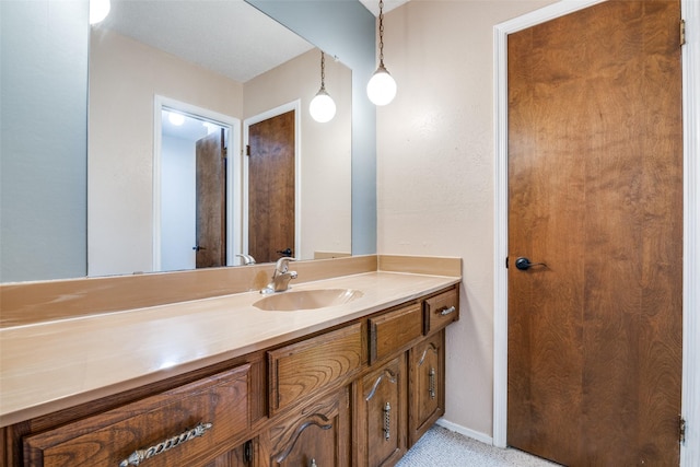 406 Los Santos Dr, Garland, TX 75043 - bathroom with vanity and baseboards