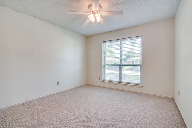 406 Los Santos Dr, Garland, TX 75043 - carpeted spare room featuring a textured ceiling and ceiling fan