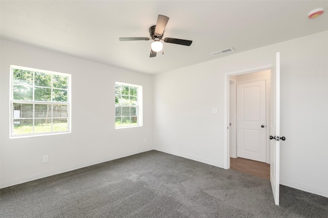 3924 Dismount St, Dallas, TX 75211 - carpeted empty room with a smoke detector and a ceiling fan