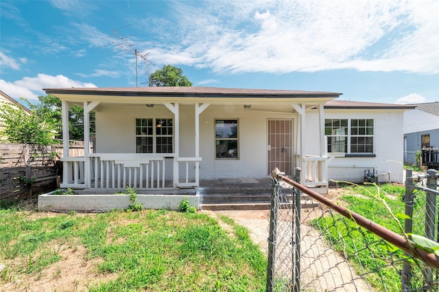 3924 Dismount St, Dallas, TX 75211 - single story home with a porch and brick siding