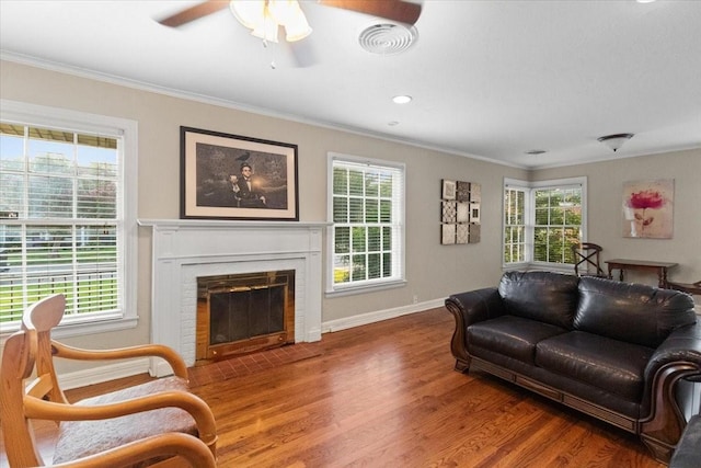 3605 Stadium Dr, Fort Worth, TX 76109 - living area featuring crown molding, wood finished floors, a brick fireplace, and ceiling fan