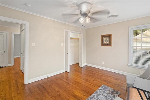 3605 Stadium Dr, Fort Worth, TX 76109 - unfurnished bedroom with wood finished floors, crown molding, and ceiling fan
