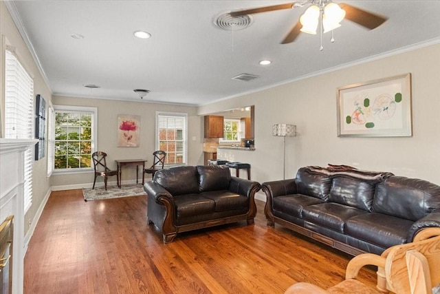 3605 Stadium Dr, Fort Worth, TX 76109 - living area with ornamental molding, wood finished floors, healthy amount of natural light, ceiling fan, and recessed lighting