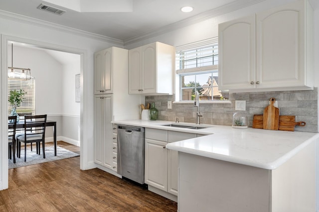 4901 Marcus Dr, Flower Mound, TX 75028 - kitchen featuring stainless steel dishwasher, tasteful backsplash, dark wood-type flooring, ornamental molding, and white cabinetry