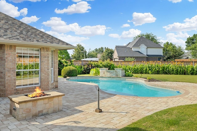 4901 Marcus Dr, Flower Mound, TX 75028 - view of swimming pool with an outdoor fire pit, a patio, and a fenced backyard